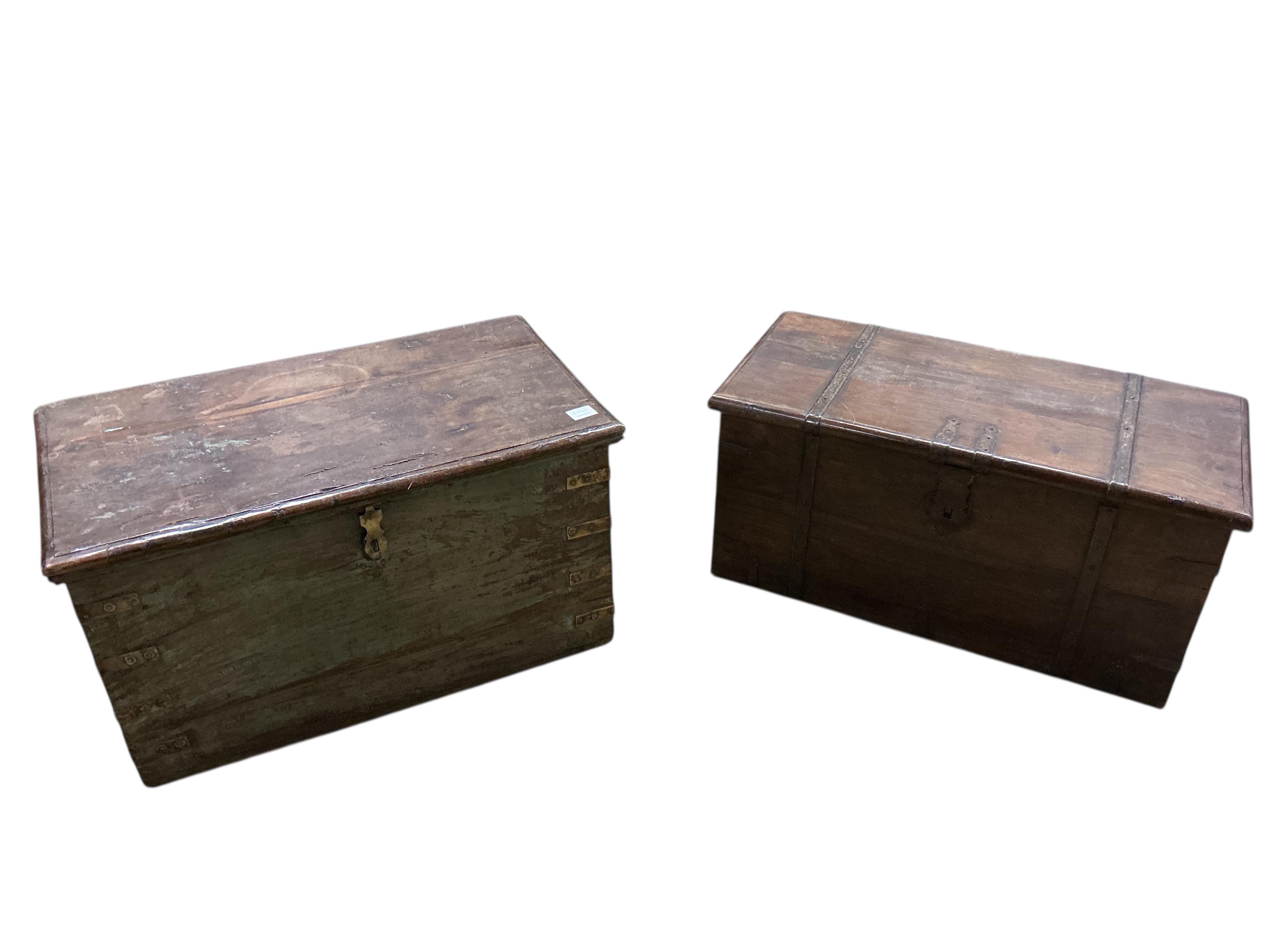 Two Indonesian iron bound hardwood trunks, larger width 80cm, depth 45cm, height 44cm together with a quantity of carvings